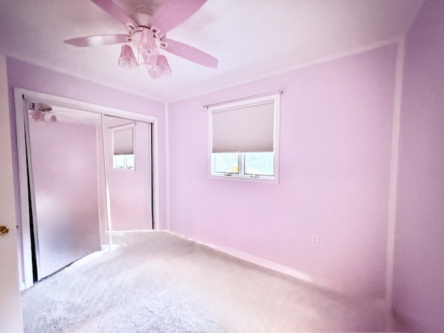 241 E Porter St, Oglesby, IL 61348 - unfurnished bedroom with carpet flooring, ceiling fan, and a closet