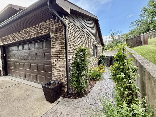 241 E Porter St, Oglesby, IL 61348 - view of side of home featuring brick siding and driveway