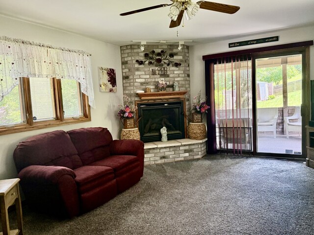 241 E Porter St, Oglesby, IL 61348 - carpeted living room with ceiling fan and a brick fireplace