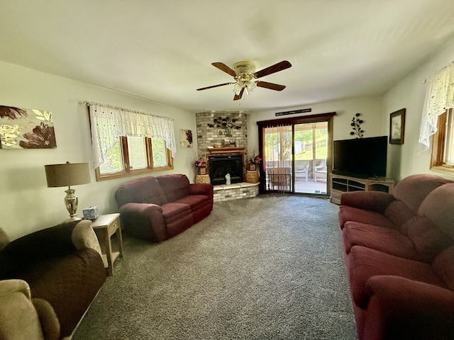 241 E Porter St, Oglesby, IL 61348 - carpeted living room with a ceiling fan and a brick fireplace