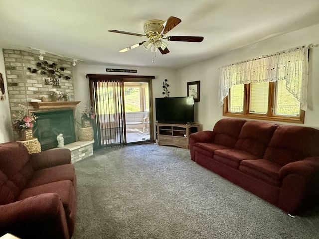 241 E Porter St, Oglesby, IL 61348 - living area with ceiling fan, carpet flooring, and a brick fireplace