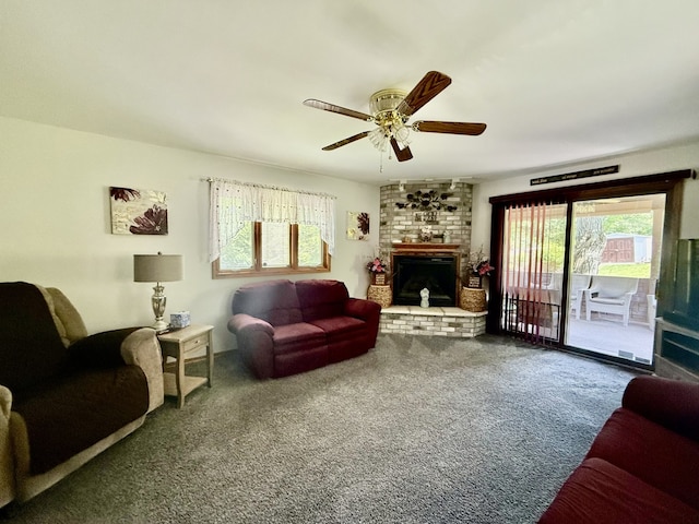 241 E Porter St, Oglesby, IL 61348 - living area with carpet floors, a fireplace, and a ceiling fan