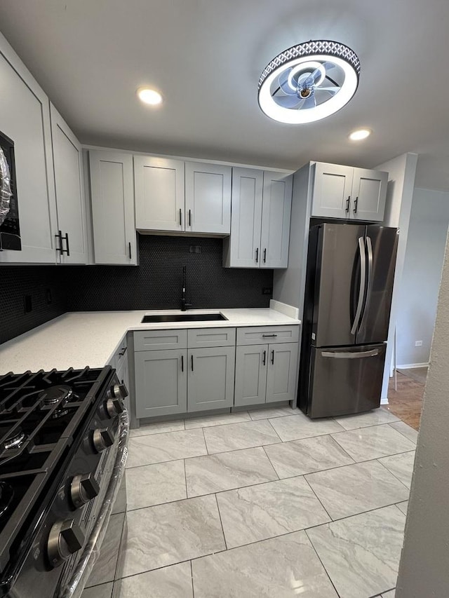 7854 S S Shore Dr Unit 402, Chicago, IL 60649 - kitchen featuring freestanding refrigerator, gas stove, light countertops, gray cabinetry, and recessed lighting