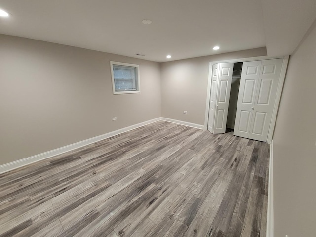 5063 N Menard Ave, Chicago, IL 60630 - unfurnished bedroom featuring recessed lighting, wood finished floors, and a closet