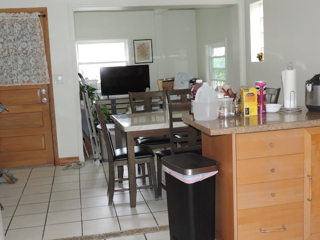 5063 N Menard Ave, Chicago, IL 60630 - kitchen featuring light tile patterned flooring and light countertops