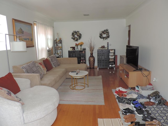5063 N Menard Ave, Chicago, IL 60630 - living room featuring wood finished floors and ornamental molding