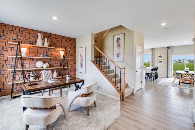 530 S Kincaid St, Maple Park, IL 60151 - kitchen featuring appliances with stainless steel finishes, recessed lighting, white cabinetry, light wood-style floors, and light stone counters