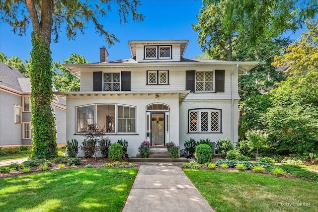 558 W Downer Pl, Aurora, IL 60506 - view of front of house featuring a front lawn and a chimney