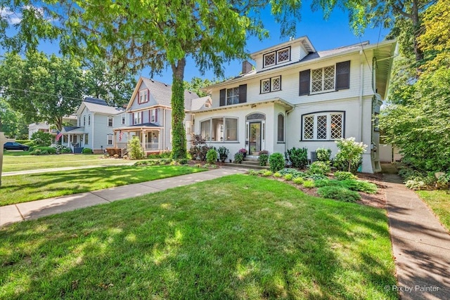 558 W Downer Pl, Aurora, IL 60506 - view of front of house featuring a front lawn and stucco siding
