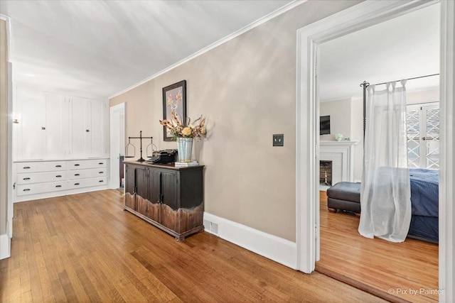 558 W Downer Pl, Aurora, IL 60506 - hallway featuring wood finished floors and ornamental molding