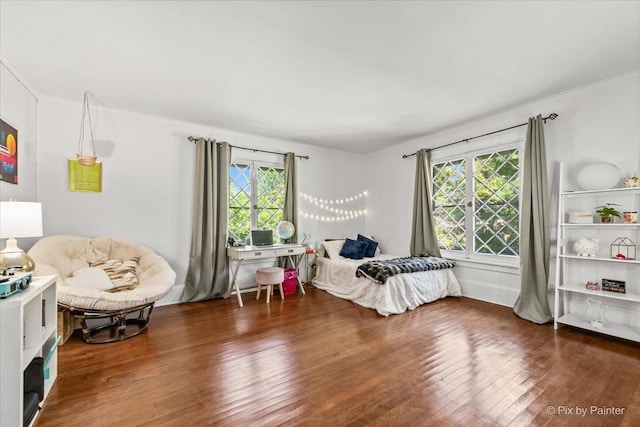 558 W Downer Pl, Aurora, IL 60506 - bedroom featuring multiple windows, wood finished floors, and ornamental molding