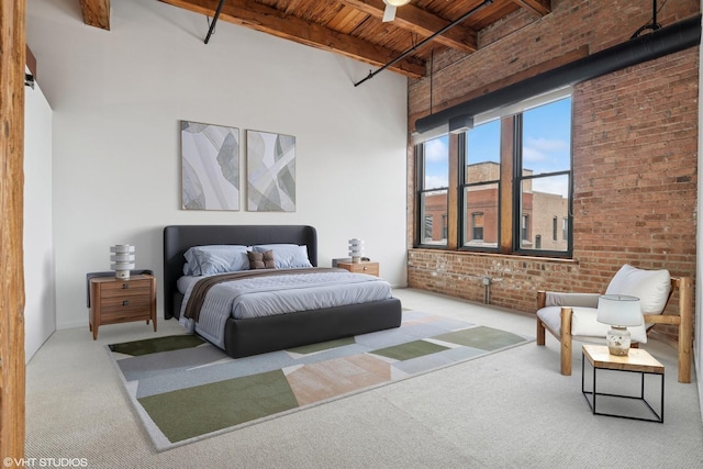 331 S Peoria St Unit Ph6, Chicago, IL 60607 - carpeted bedroom with a wood ceiling with exposed beams, brick wall, and a towering ceiling