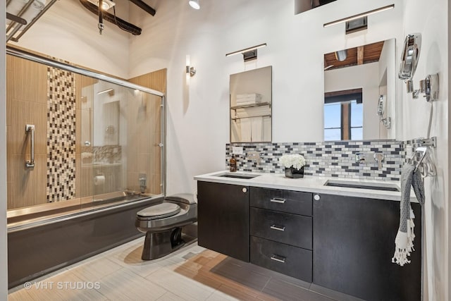 331 S Peoria St Unit Ph6, Chicago, IL 60607 - full bathroom featuring decorative backsplash, double vanity, and bath / shower combo with glass door