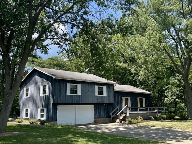 13809 Pine Rd, Dewitt, IL 61735 - view of front facade with a front yard, a garage, and driveway