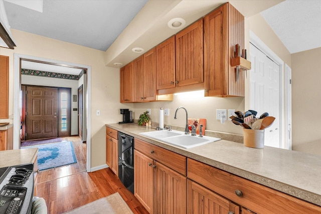 13809 Pine Rd, Dewitt, IL 61735 - kitchen featuring light wood finished floors, black dishwasher, light countertops, and range