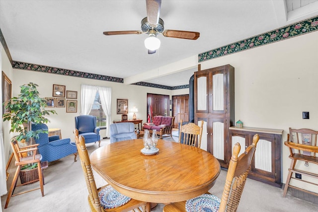 13809 Pine Rd, Dewitt, IL 61735 - dining area with light colored carpet and ceiling fan