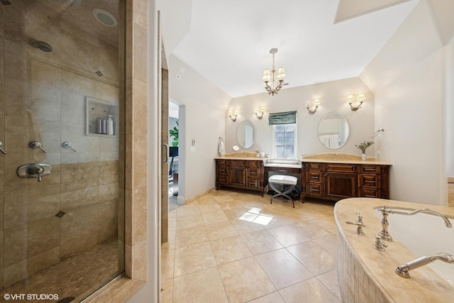 437 N County Line Rd, Hinsdale, IL 60521 - bathroom with a stall shower, two vanities, tiled tub, tile patterned flooring, and a chandelier