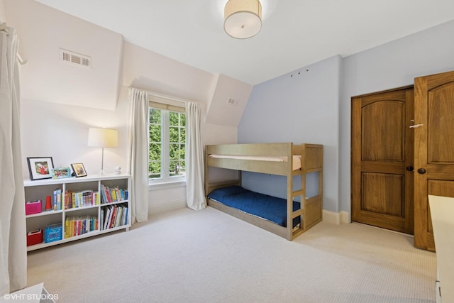 437 N County Line Rd, Hinsdale, IL 60521 - carpeted bedroom featuring baseboards and lofted ceiling