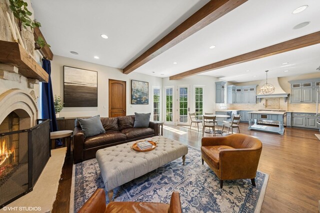 437 N County Line Rd, Hinsdale, IL 60521 - living area featuring a warm lit fireplace, wood finished floors, recessed lighting, and beam ceiling