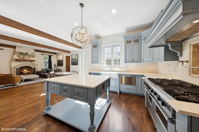 437 N County Line Rd, Hinsdale, IL 60521 - kitchen with gray cabinetry, custom exhaust hood, stainless steel appliances, light countertops, and recessed lighting