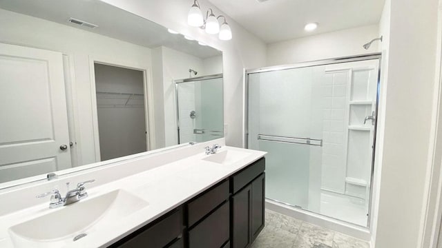 1038 Emerald Dr, Montgomery, IL 60538 - full bath featuring a shower stall, double vanity, and a spacious closet