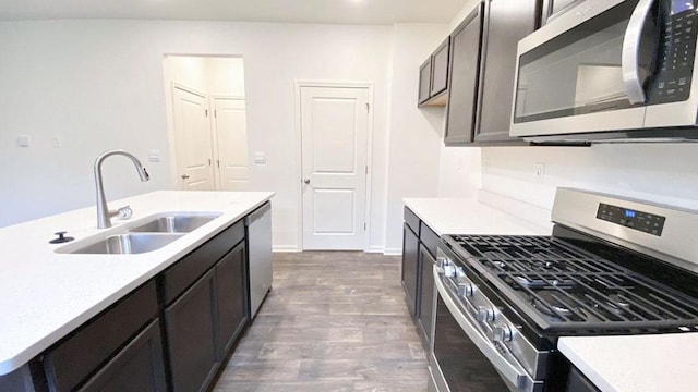 1038 Emerald Dr, Montgomery, IL 60538 - kitchen with appliances with stainless steel finishes, dark wood-style floors, and light countertops