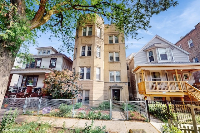 3253 W Leland Ave Unit 2, Chicago, IL 60625 - view of front of property with a gate, a fenced front yard, covered porch, and stairway