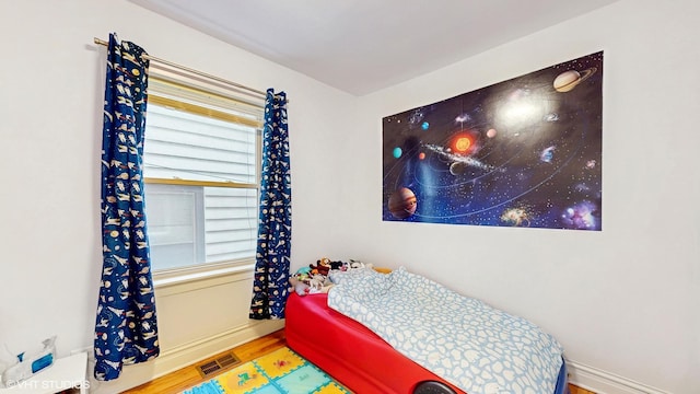 3253 W Leland Ave Unit 2, Chicago, IL 60625 - bedroom with wood finished floors and baseboards