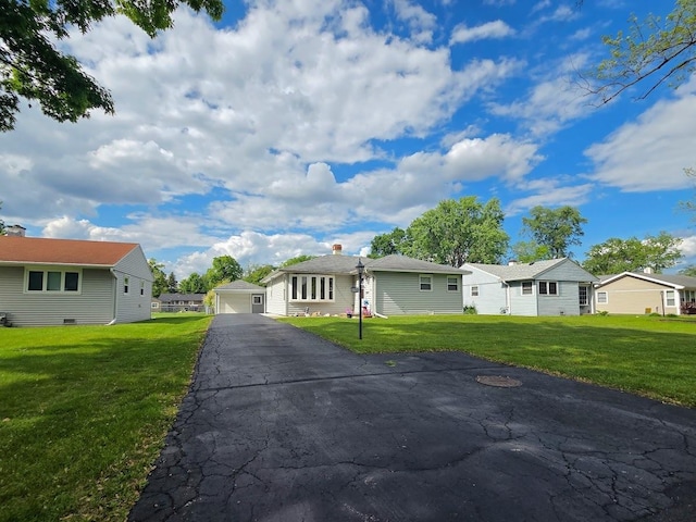 2310 Eastman St, Rolling Meadows, IL 60008 - ranch-style house featuring a detached garage, a front yard, an outbuilding, and a residential view