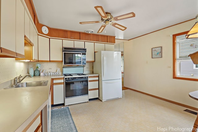 2310 Eastman St, Rolling Meadows, IL 60008 - kitchen featuring white appliances, light countertops, backsplash, a ceiling fan, and light floors