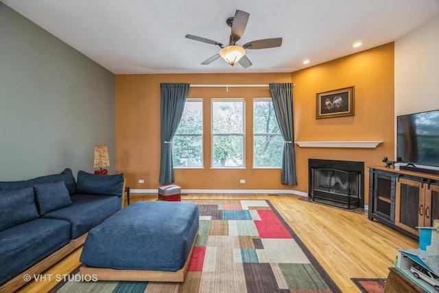 108 Belvidere Ave, Forest Park, IL 60130 - living room with wood finished floors, a fireplace with flush hearth, ceiling fan, and recessed lighting