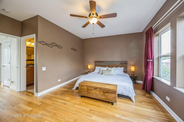 108 Belvidere Ave, Forest Park, IL 60130 - bedroom featuring light wood finished floors, ensuite bathroom, and a ceiling fan