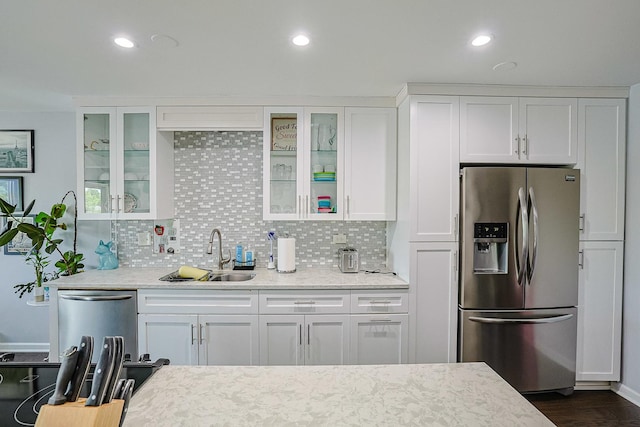2424 E Oakton St Unit 3E, Arlington Heights, IL 60004 - kitchen featuring stainless steel appliances, white cabinets, backsplash, glass insert cabinets, and recessed lighting
