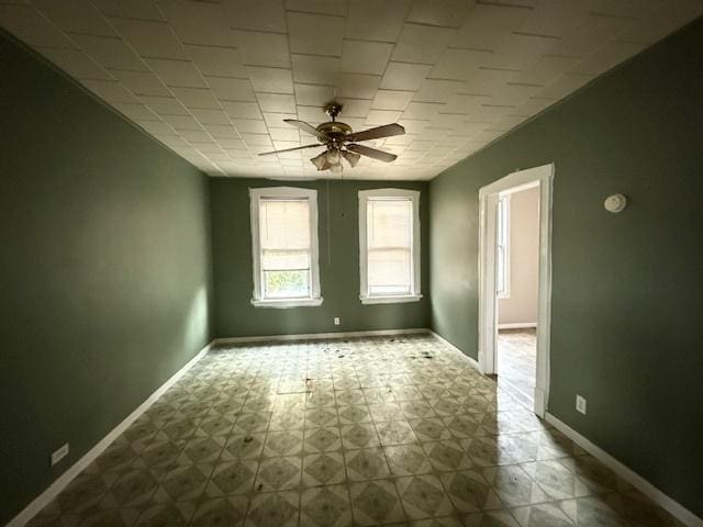 4904 W 31st St, Cicero, IL 60804 - empty room with ceiling fan and tile patterned floors