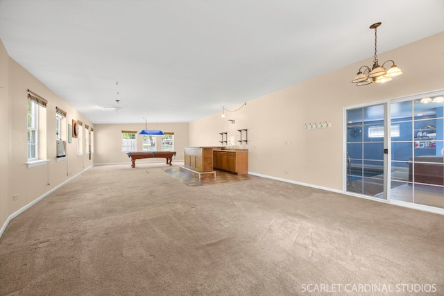 7334 Maridon Rd, Countryside, IL 60525 - unfurnished living room with light carpet, a chandelier, and billiards