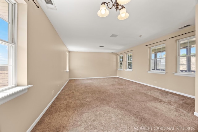7334 Maridon Rd, Countryside, IL 60525 - unfurnished room featuring carpet floors and a chandelier