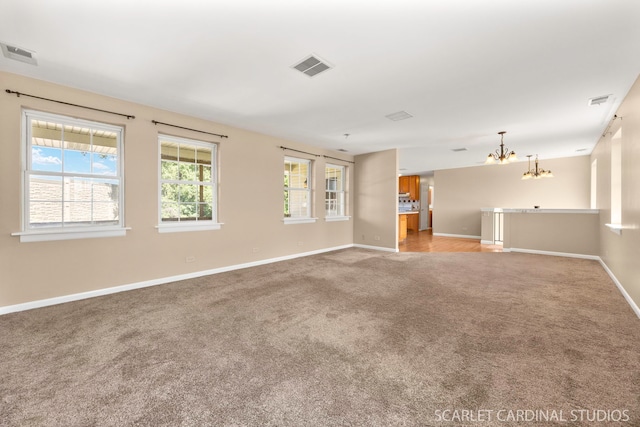 7334 Maridon Rd, Countryside, IL 60525 - unfurnished room with light carpet and a chandelier