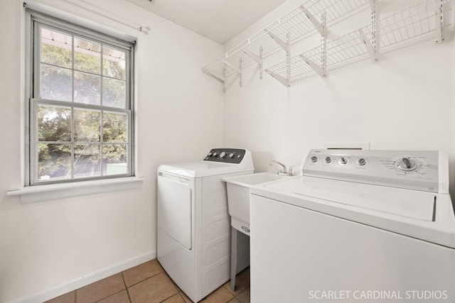 7334 Maridon Rd, Countryside, IL 60525 - washroom featuring washer and clothes dryer and light tile patterned floors