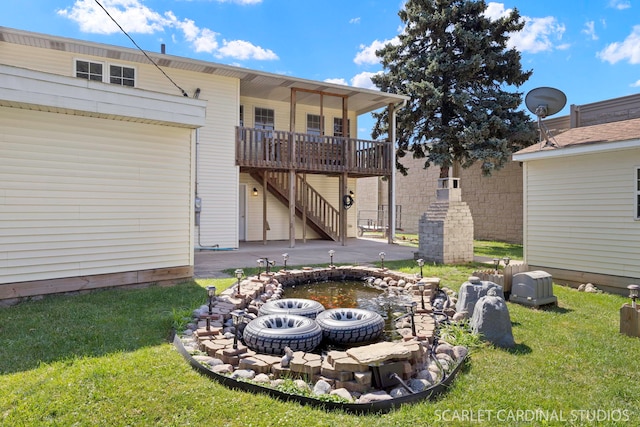 7334 Maridon Rd, Countryside, IL 60525 - back of property featuring stairs, a lawn, a wooden deck, and a garden pond