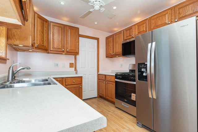 230 Brierhill Dr, Round Lake Park, IL 60073 - kitchen with appliances with stainless steel finishes, light countertops, recessed lighting, brown cabinets, and light wood-type flooring