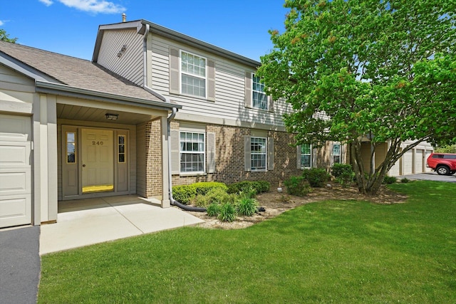 240 Crestview Dr Unit B, Wauconda, IL 60084 - view of front of property with brick siding and a front lawn