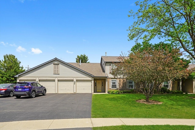 240 Crestview Dr Unit B, Wauconda, IL 60084 - view of front of home featuring a front lawn, an attached garage, asphalt driveway, and a shingled roof