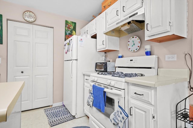 240 Crestview Dr Unit B, Wauconda, IL 60084 - kitchen featuring white appliances, under cabinet range hood, white cabinets, and light countertops