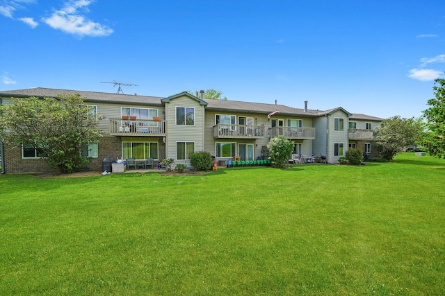 240 Crestview Dr Unit B, Wauconda, IL 60084 - rear view of property with a yard, a balcony, and a patio
