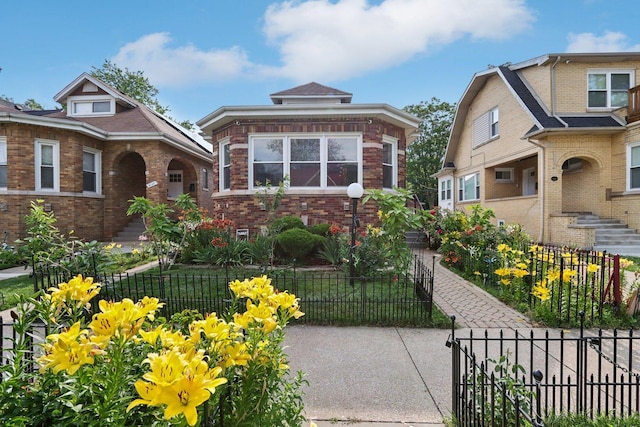 8120 S Luella Ave, Chicago, IL 60617 - bungalow featuring a fenced front yard and brick siding