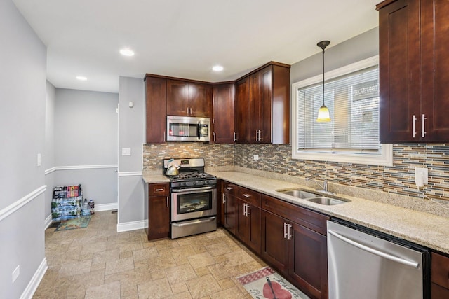 8120 S Luella Ave, Chicago, IL 60617 - kitchen with appliances with stainless steel finishes, backsplash, light stone countertops, pendant lighting, and recessed lighting