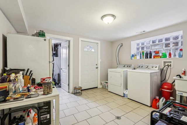 8120 S Luella Ave, Chicago, IL 60617 - laundry area featuring washing machine and clothes dryer and light tile patterned floors