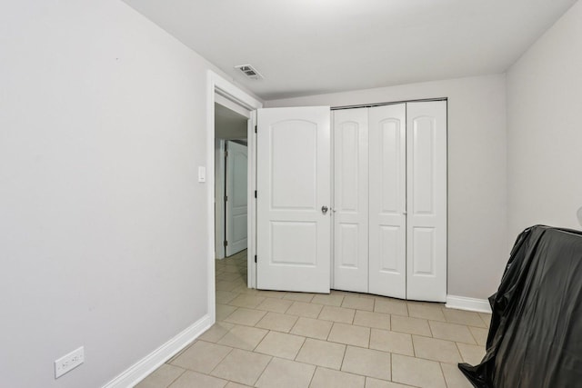8120 S Luella Ave, Chicago, IL 60617 - bedroom featuring light tile patterned flooring and a closet