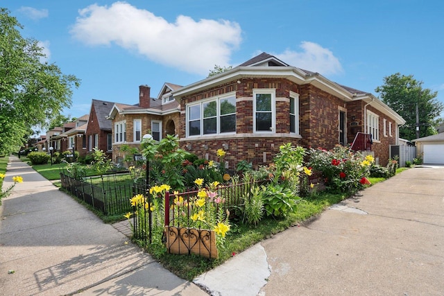 8120 S Luella Ave, Chicago, IL 60617 - view of front of home featuring brick siding, a detached garage, an outbuilding, and a chimney