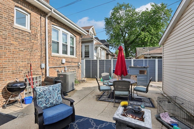 8120 S Luella Ave, Chicago, IL 60617 - fenced backyard with a patio, outdoor dining area, an outdoor fire pit, and area for grilling